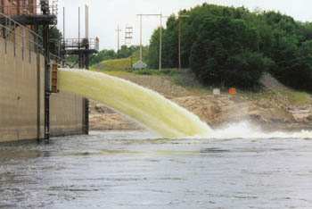 the river coming through the dam