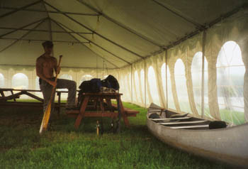 seeking shelter from the rain in a big tent