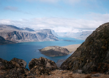 to the north is a spectacular valley with snowy peaks