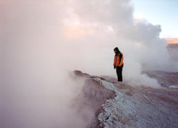 peering into a pool of boiling gray mud