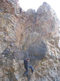 mike rappelling down the cliff - by joy