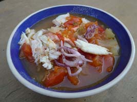 fish soup, with crab, salmon, sole, squid, and vegetables