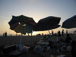 beach umbrellas at sunset
